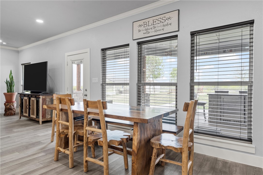 1227 Alexander Road Moody, TX 76557 - Photo 19 of 66 a view of a dining room with furniture window and wooden floor