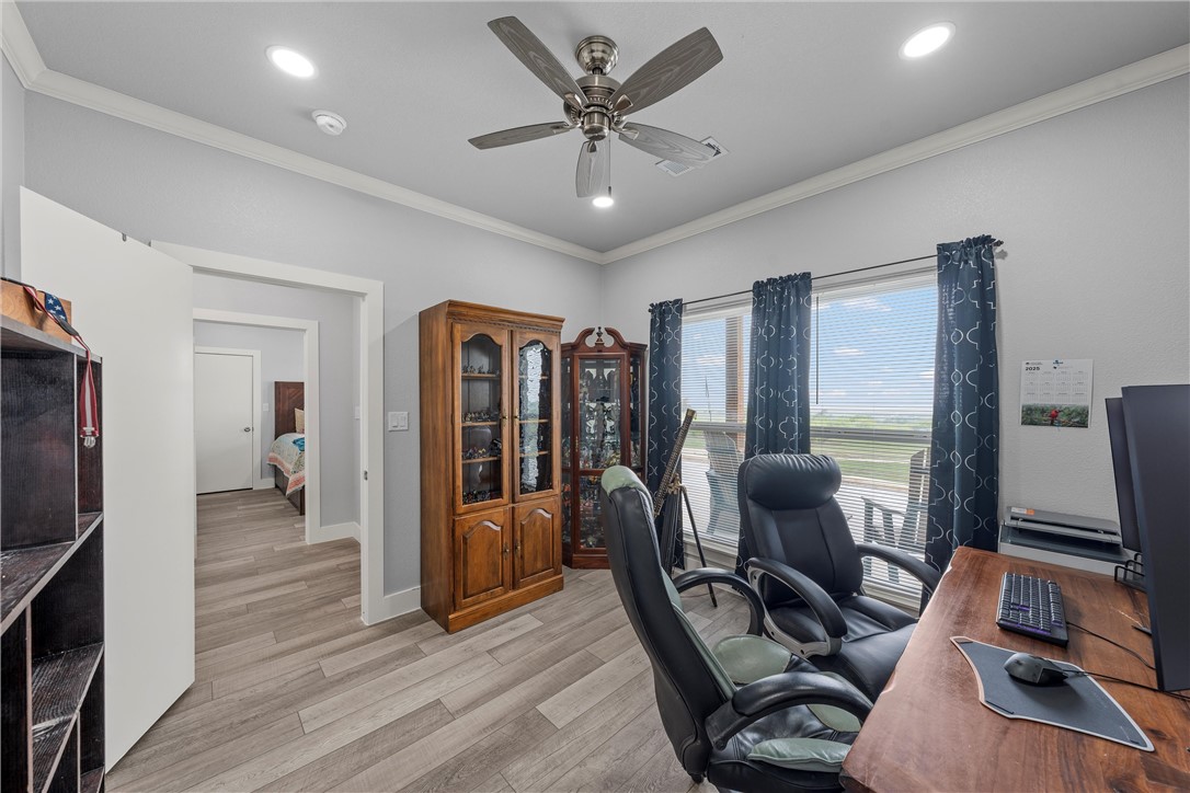 1227 Alexander Road Moody, TX 76557 - Photo 21 of 66 a view of a workspace with furniture and wooden floor
