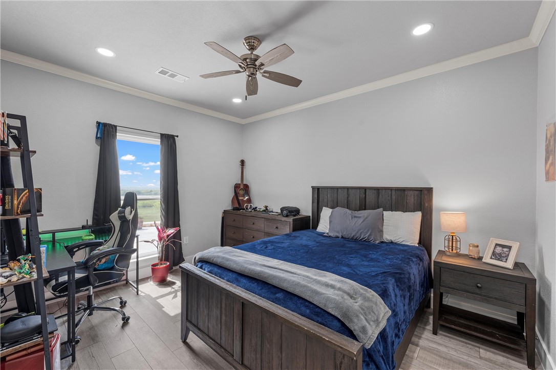 1227 Alexander Road Moody, TX 76557 - Photo 24 of 66 a bed room with a bed and a lamp