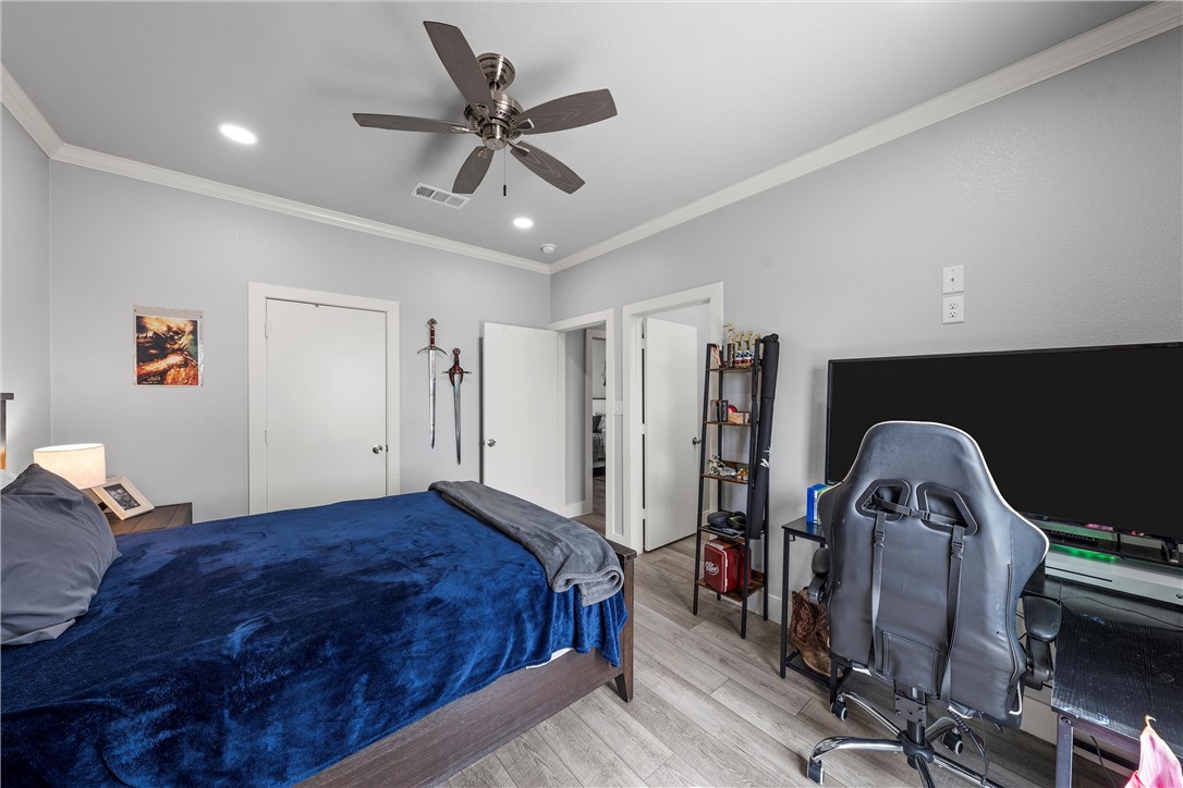 1227 Alexander Road Moody, TX 76557 - Photo 25 of 66 a bed room with a bed and a ceiling fan
