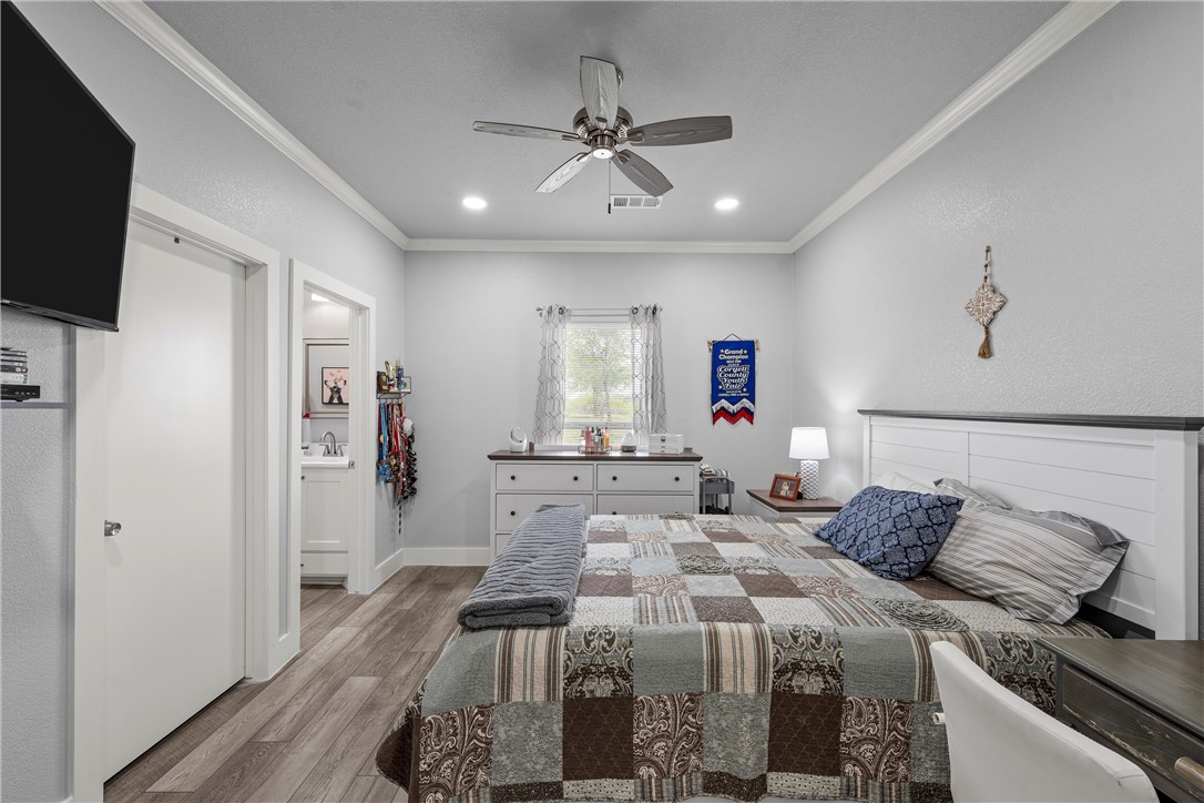 1227 Alexander Road Moody, TX 76557 - Photo 27 of 66 a bedroom with a bed and a flat screen tv