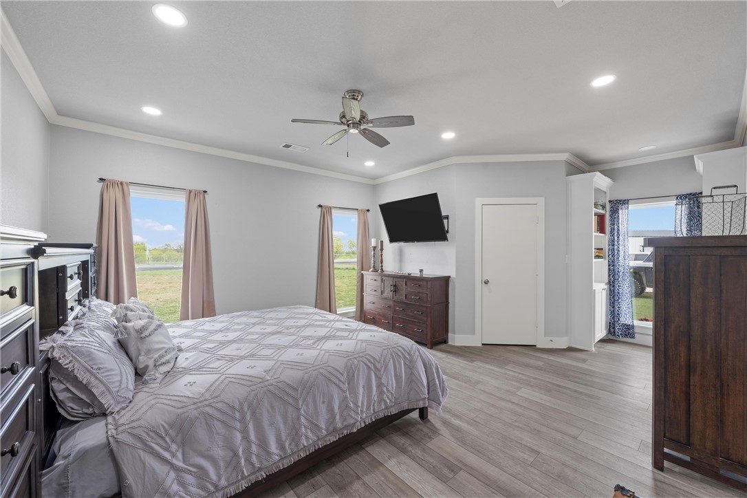 1227 Alexander Road Moody, TX 76557 - Photo 30 of 66 a spacious bedroom with a bed and a flat screen television