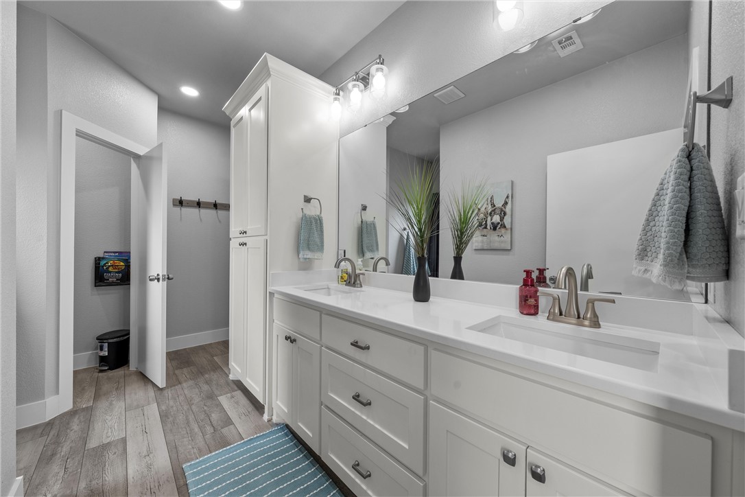 1227 Alexander Road Moody, TX 76557 - Photo 32 of 66 a bathroom with a double vanity sink and a mirror