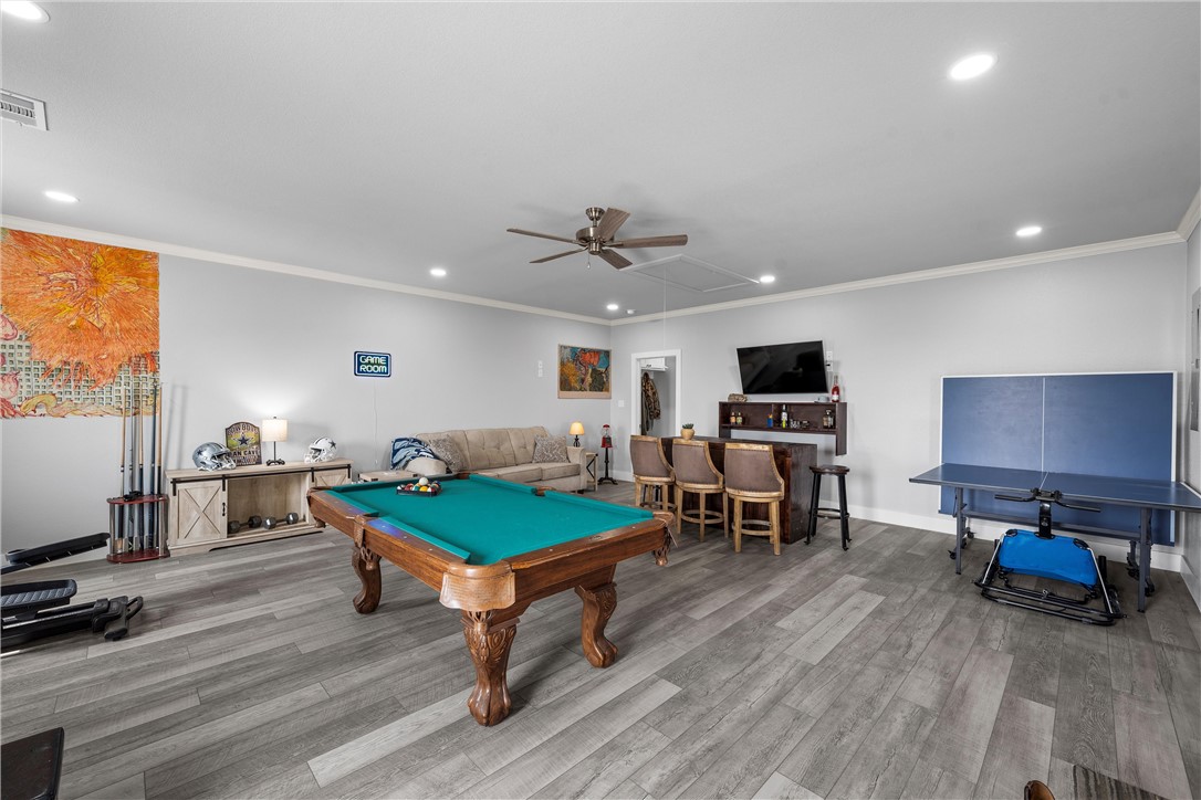 1227 Alexander Road Moody, TX 76557 - Photo 37 of 66 a living room with furniture pool table and a flat screen tv