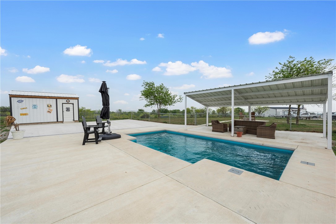 1227 Alexander Road Moody, TX 76557 - Photo 48 of 66 a view of a backyard with sitting area and garden