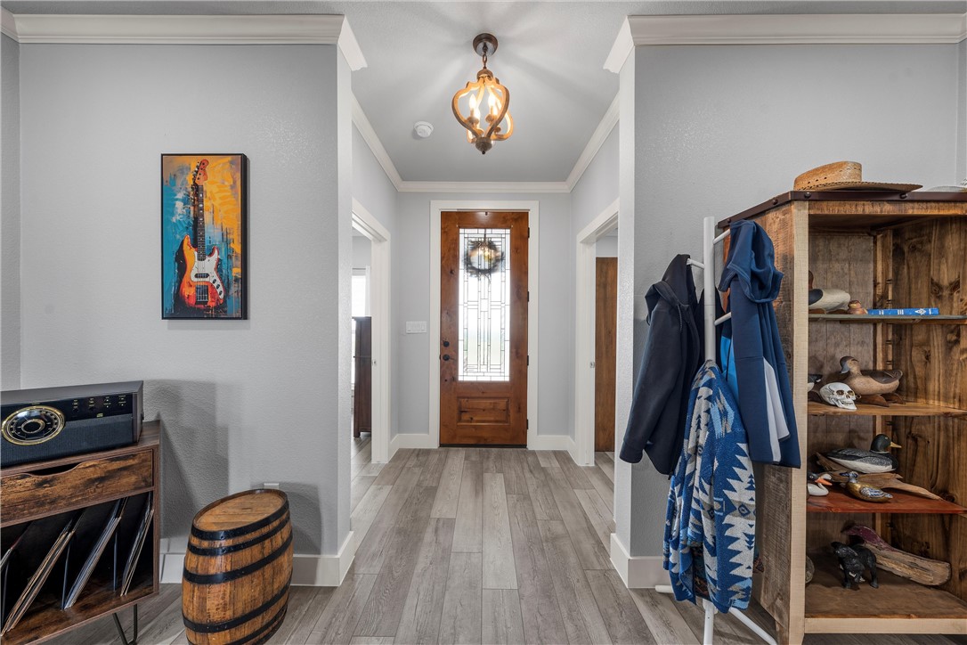 1227 Alexander Road Moody, TX 76557 - Photo 7 of 66 a view of a hallway with wooden floor and furniture
