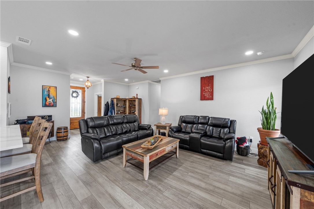 1227 Alexander Road Moody, TX 76557 - Photo 9 of 66 a living room with furniture and a flat screen tv