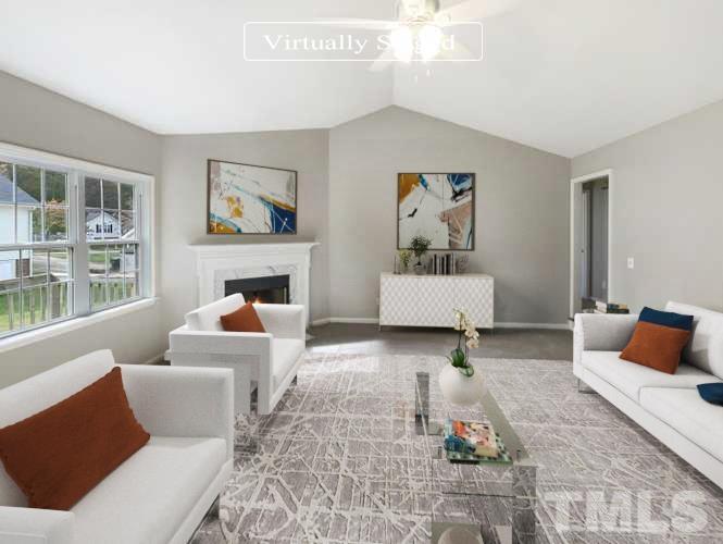 1105 Curtiss Drive Garner, NC 27529 - Photo 2 of 17 a living room with furniture and a fireplace