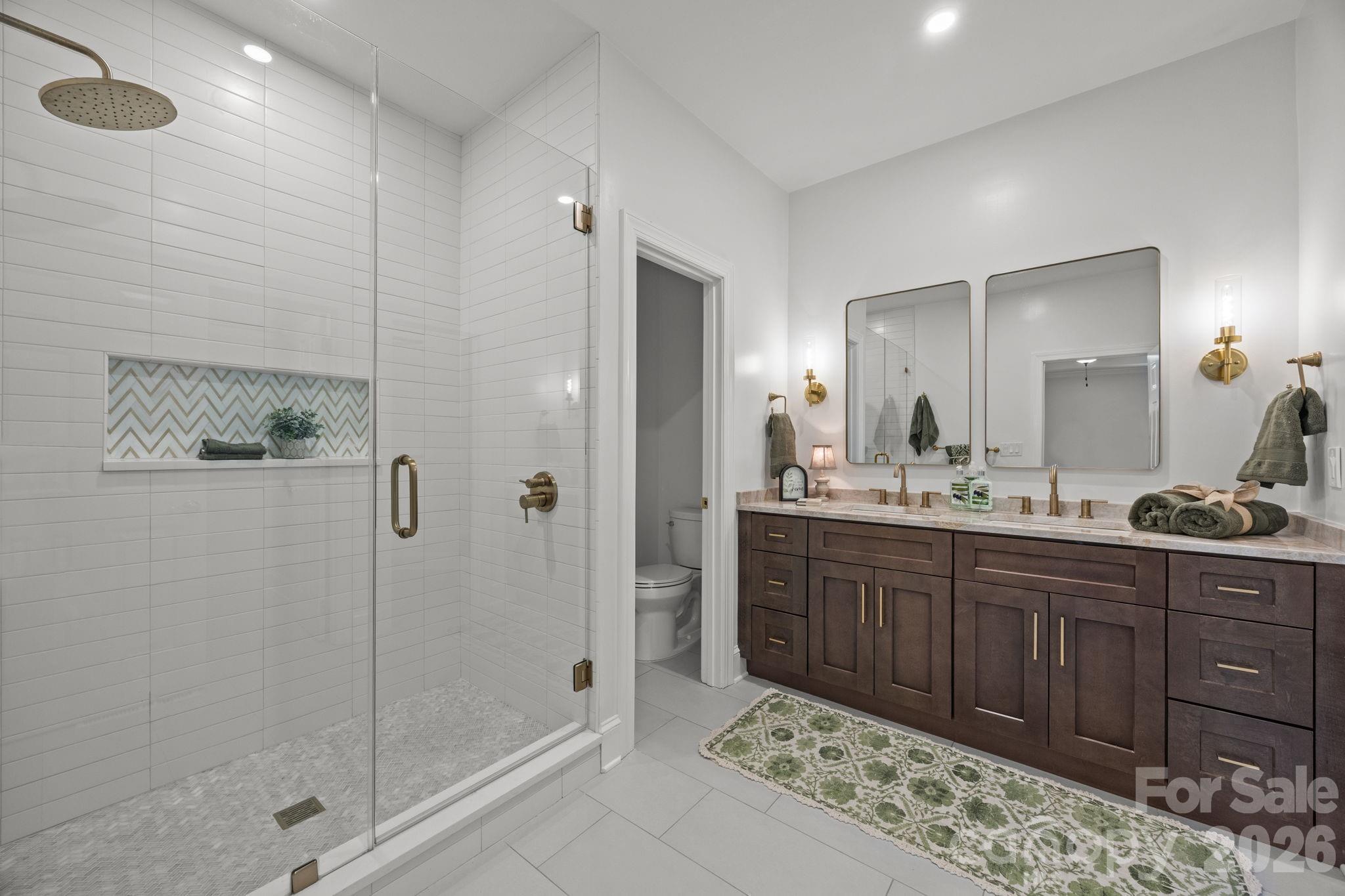 5243 Mintridge Road Mint Hill, NC 28227 - Photo 21 of 43 a bathroom with a double vanity sink mirror and shower