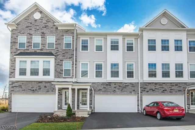 a car parked in front of a brick building