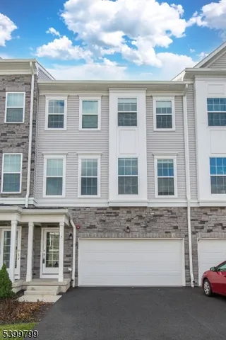 a front view of a building with a lot of windows