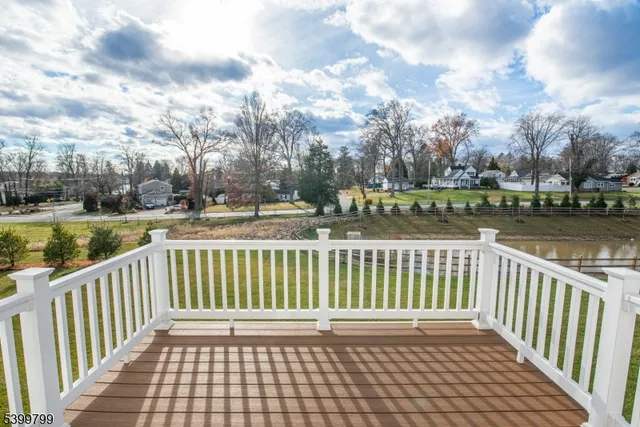 a view of a yard with wooden floor and lake view