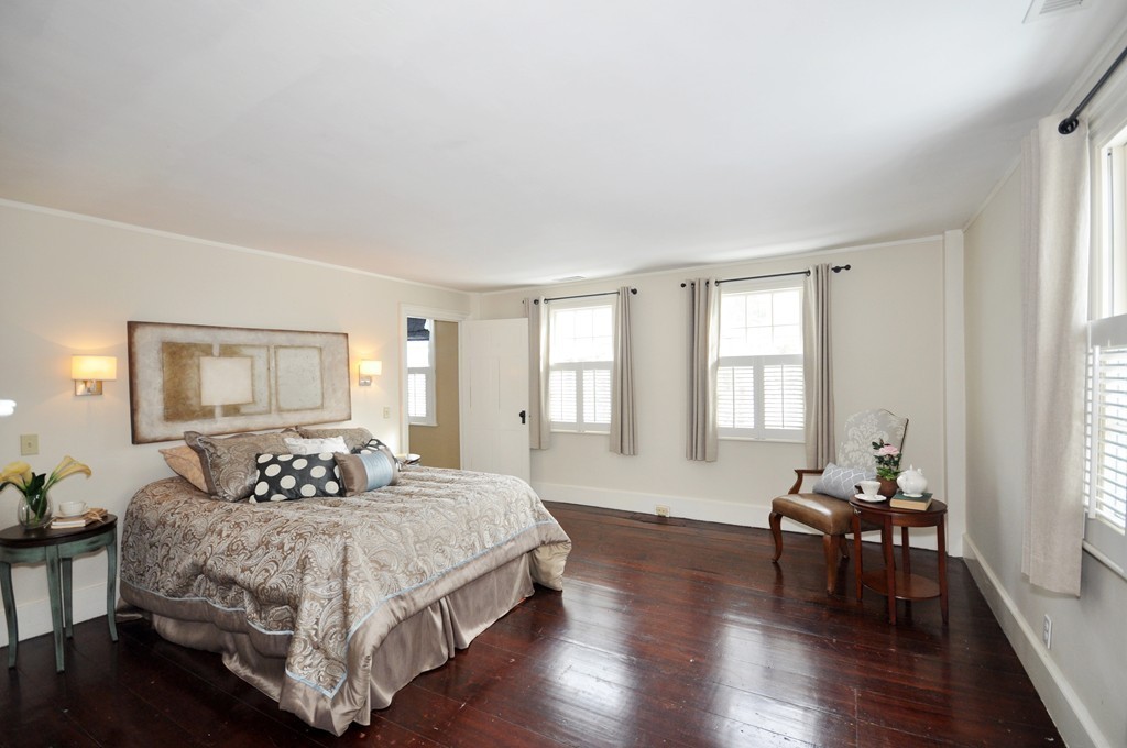29 Lincoln Road Lincoln, MA 01773 - Photo 12 of 19 a bedroom with a bed and wooden floor