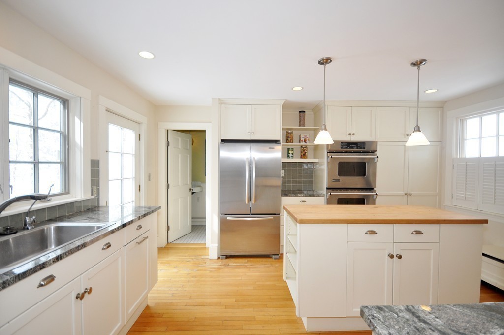 29 Lincoln Road Lincoln, MA 01773 - Photo 5 of 19 a kitchen with stainless steel appliances a sink stove and refrigerator