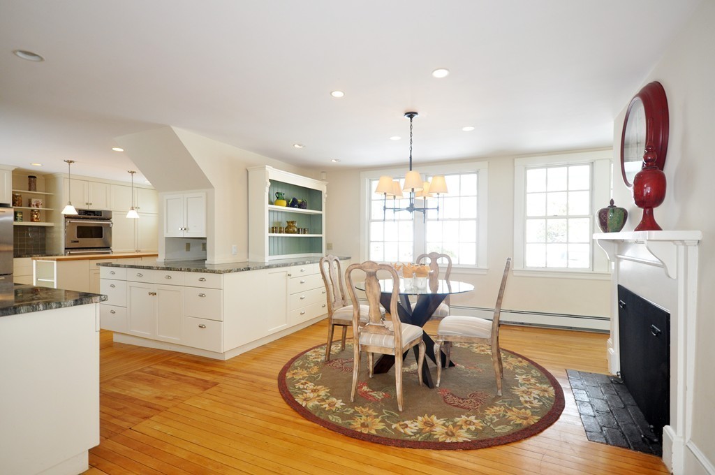 29 Lincoln Road Lincoln, MA 01773 - Photo 7 of 19 a living room with fireplace furniture and a wooden floor