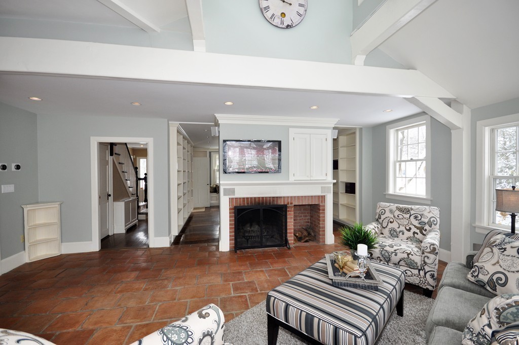 29 Lincoln Road Lincoln, MA 01773 - Photo 9 of 19 a living room with furniture and a fireplace