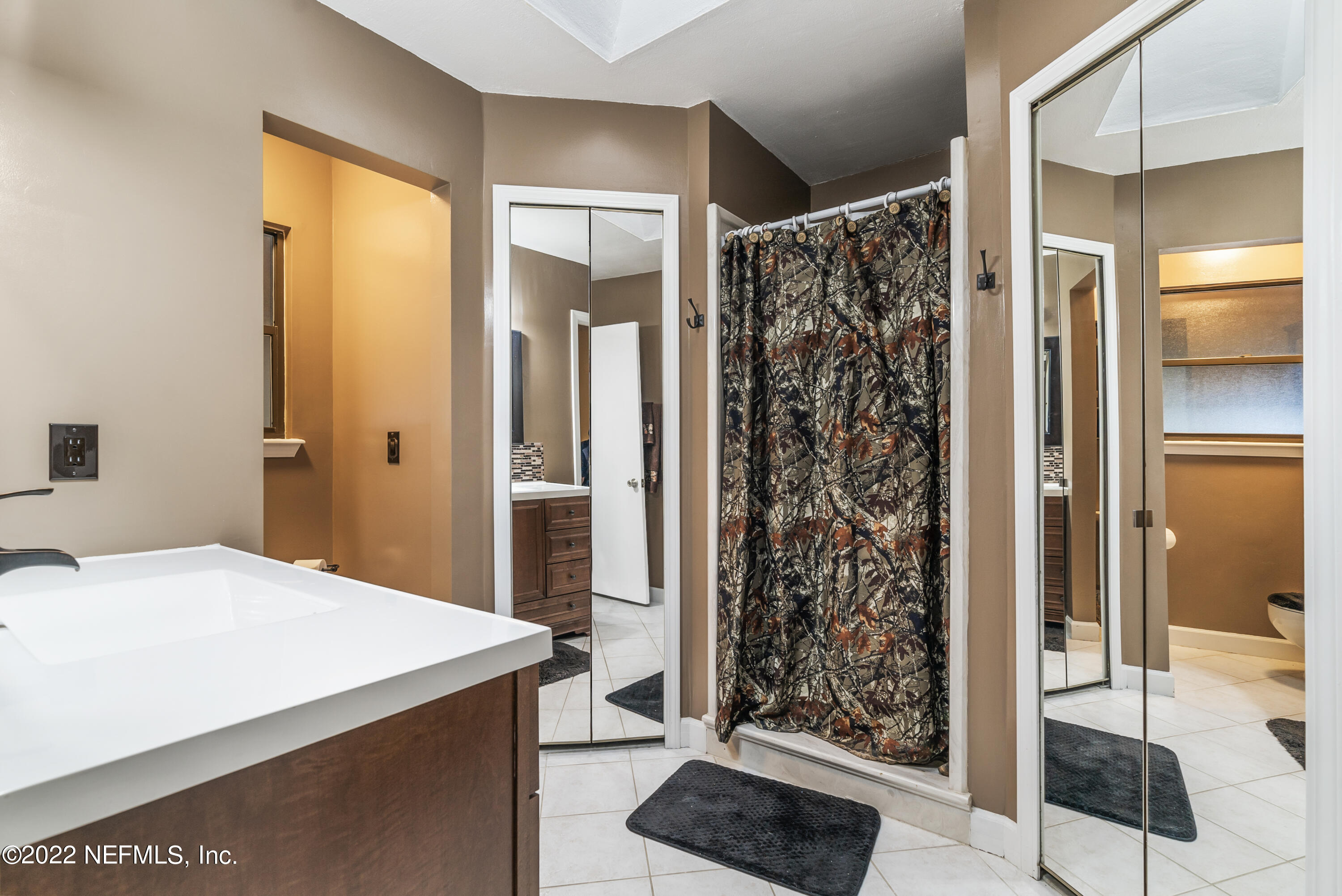 288 West Shores Road Fleming Island, FL 32003 - Photo 12 of 36 a bathroom with a shower and a sink