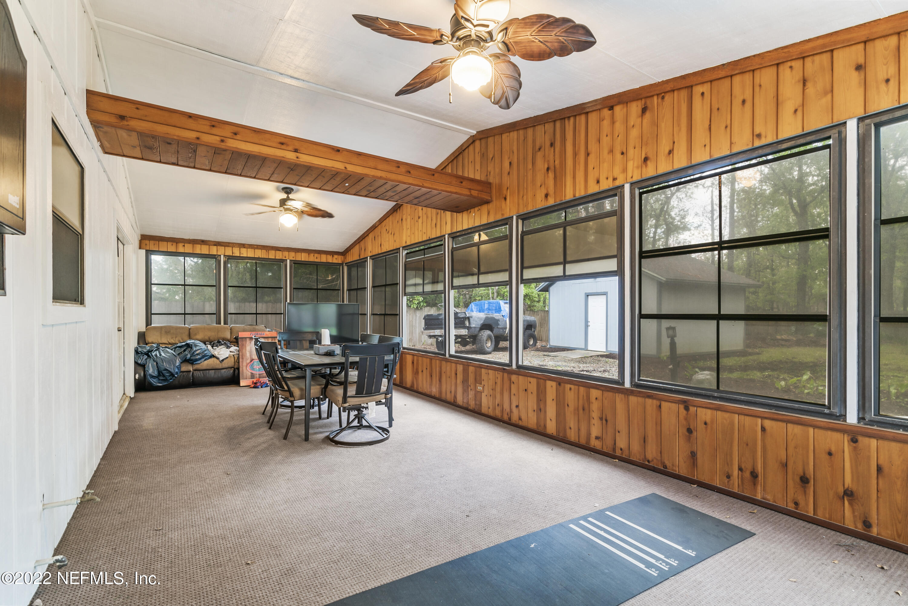 288 West Shores Road Fleming Island, FL 32003 - Photo 29 of 36 a dining room with furniture water view and a large window