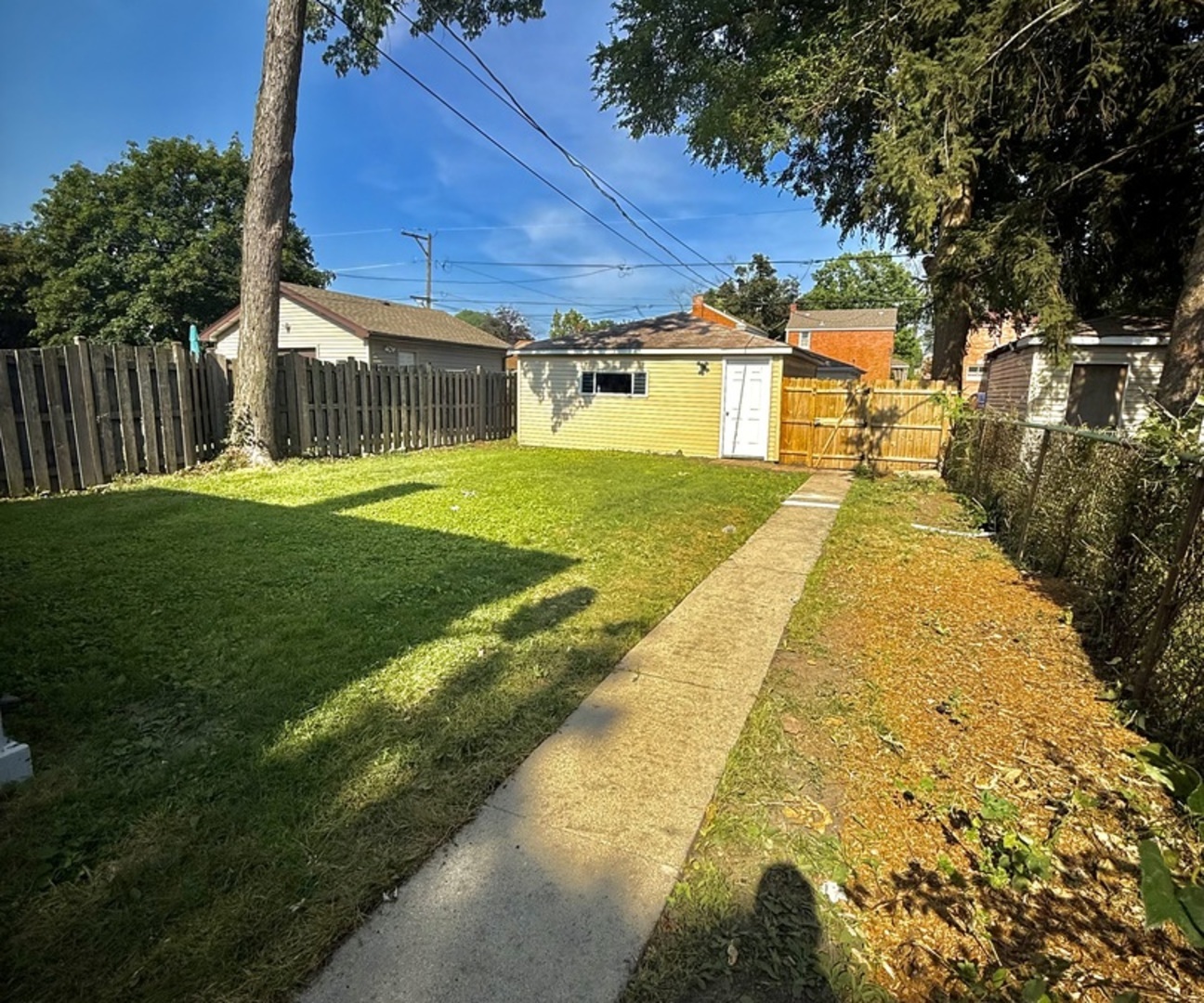 2003 South 24th Avenue Broadview, IL 60155 - Photo 13 of 14 a front view of a house with a yard