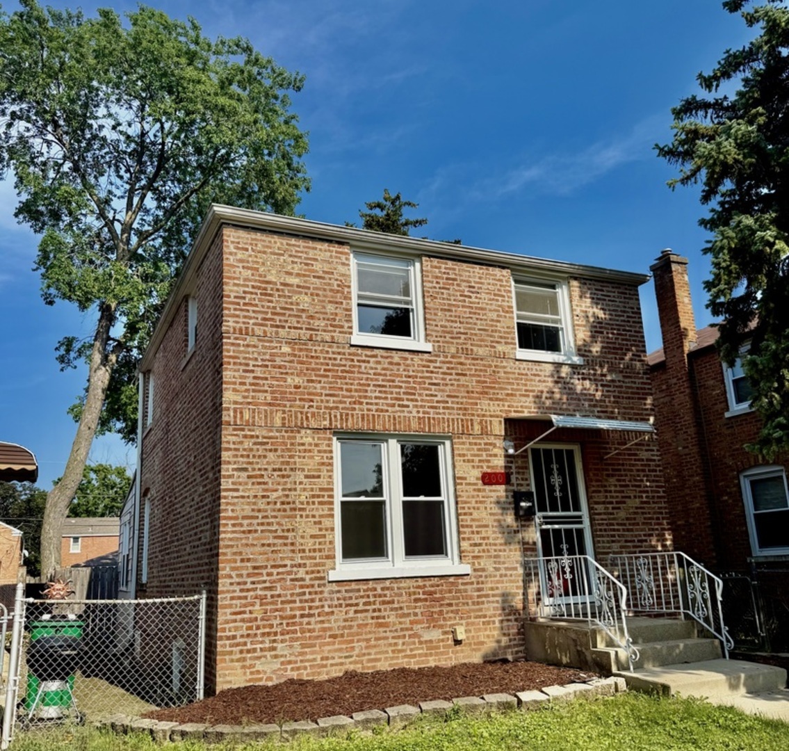 2003 South 24th Avenue Broadview, IL 60155 - Photo 2 of 14 front view of house with a yard