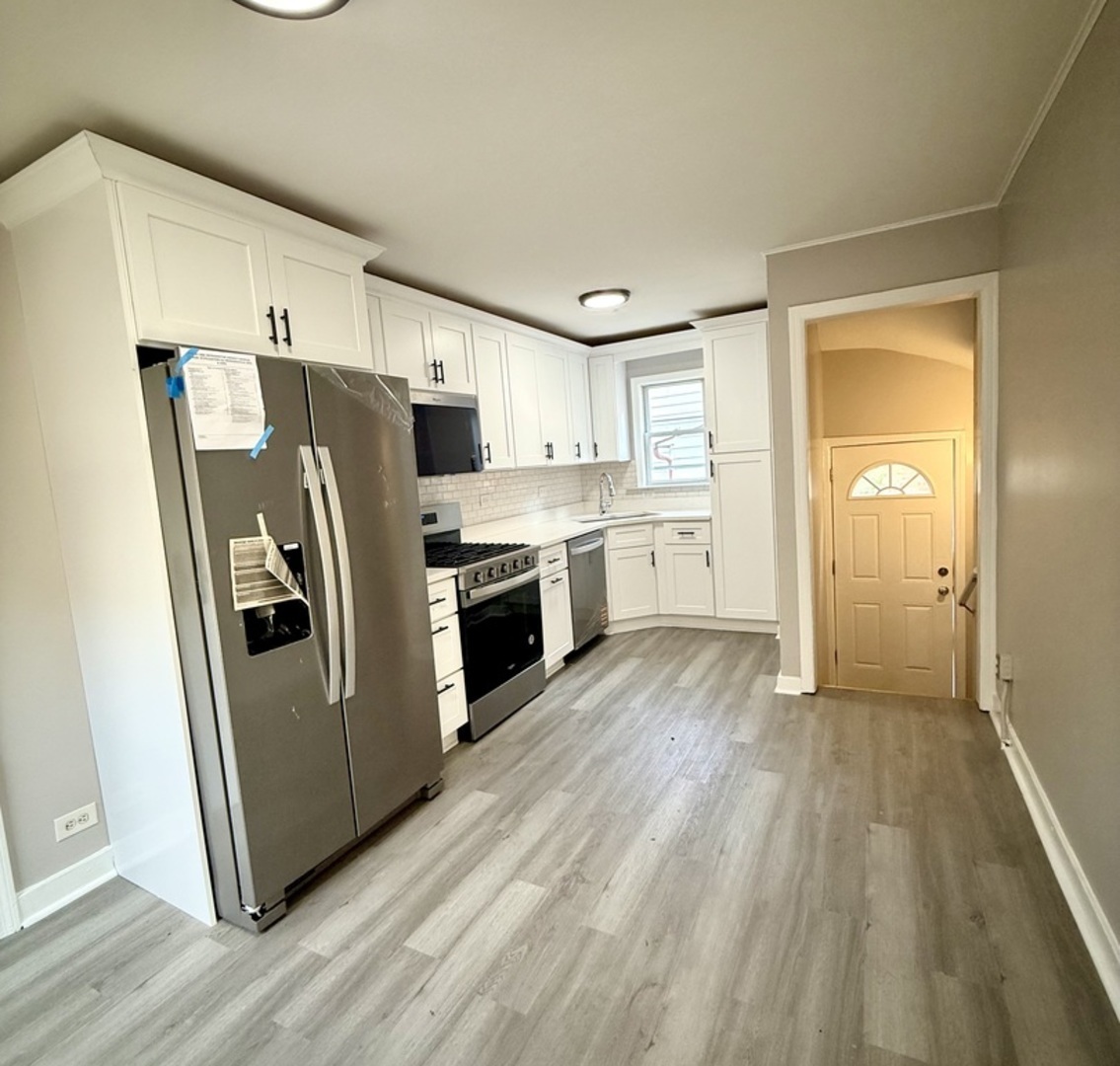 2003 South 24th Avenue Broadview, IL 60155 - Photo 5 of 14 a kitchen with stainless steel appliances a refrigerator sink and microwave