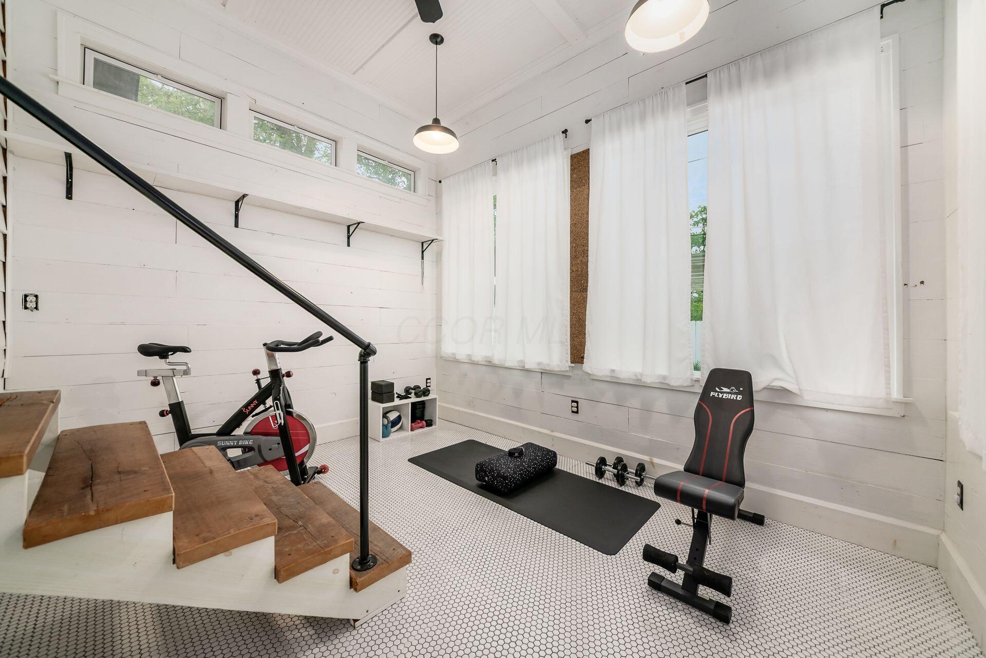 235 East Kelso Road Columbus, OH 43202 - Photo 39 of 50 3 season room being used as a work out space