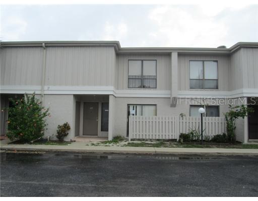 4001 South Beneva Road, Unit 317 Sarasota, FL 34233 - Photo 1 of 1 a front view of a house with a yard