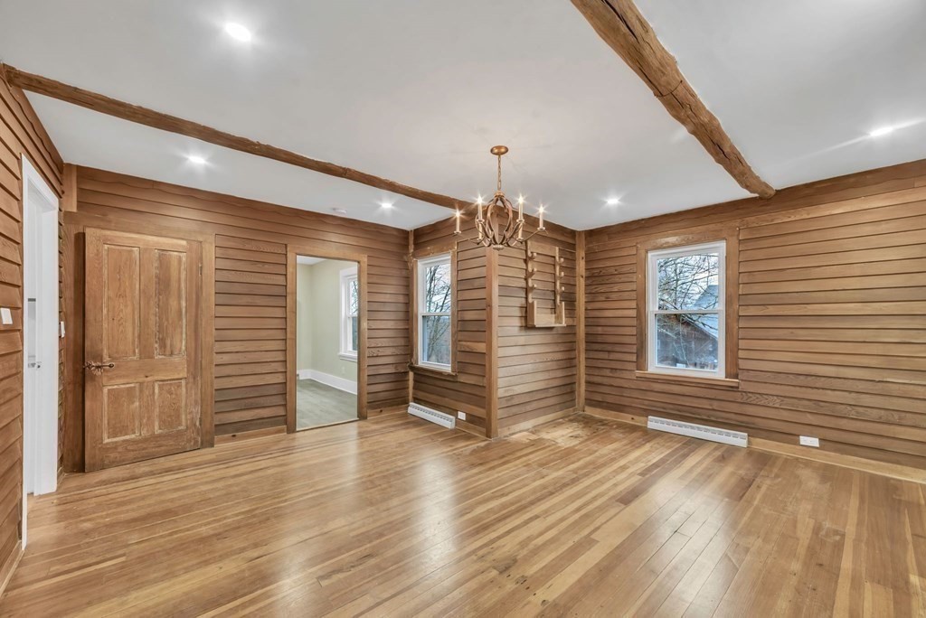 1385 Lyon Street Ludlow, MA 01056 - Photo 11 of 35 an empty room with wooden floor and windows