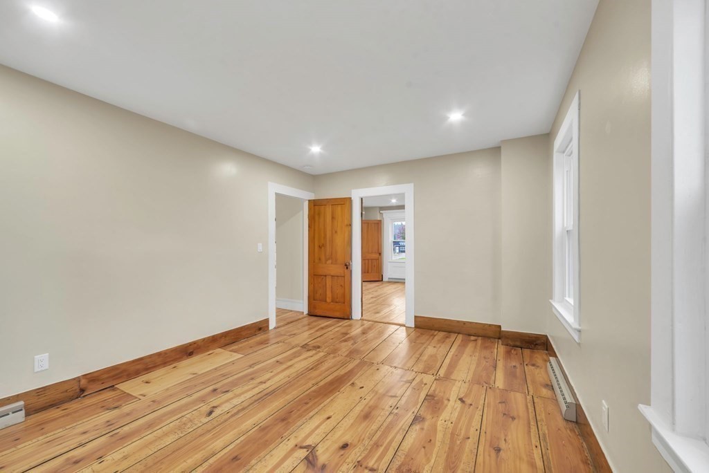 1385 Lyon Street Ludlow, MA 01056 - Photo 17 of 35 a view of an empty room with wooden floor