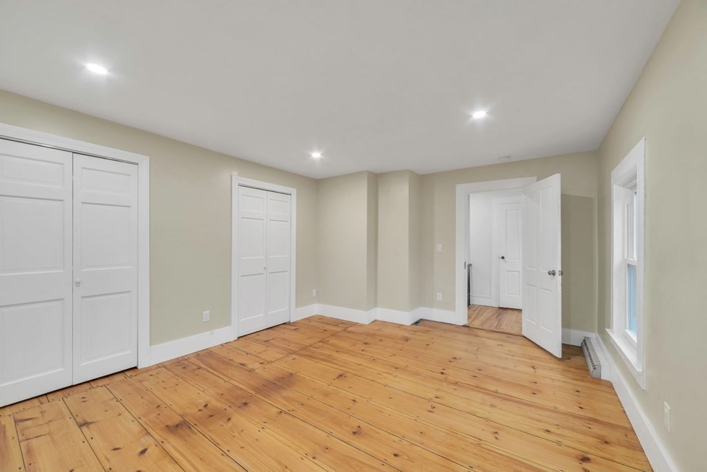 1385 Lyon Street Ludlow, MA 01056 - Photo 27 of 35 a bedroom with a bed and a window