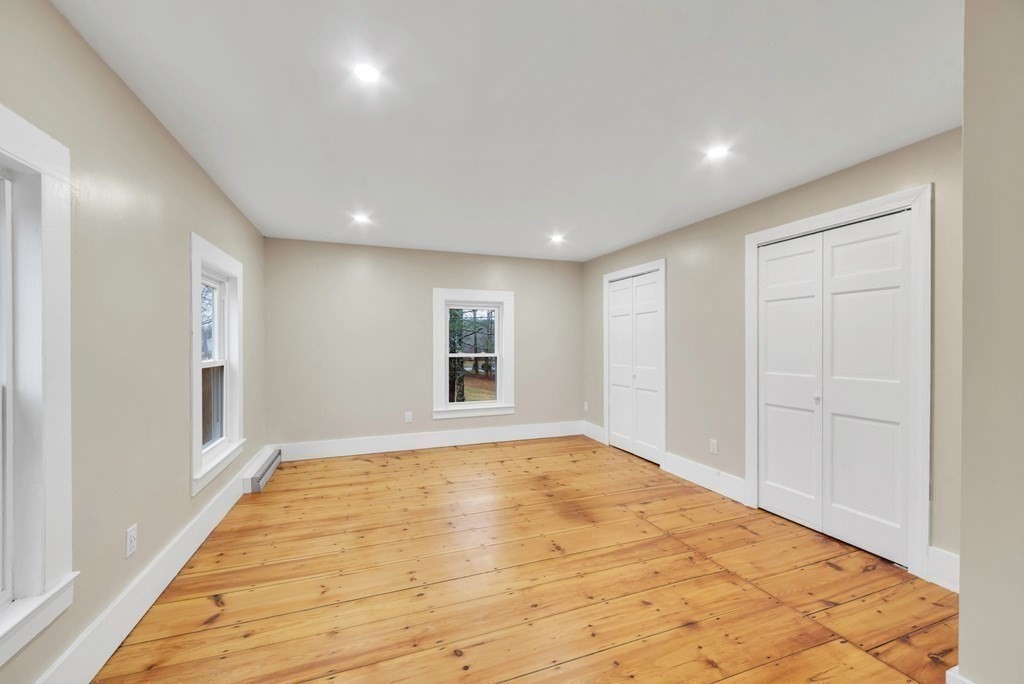 1385 Lyon Street Ludlow, MA 01056 - Photo 28 of 35 a view of empty room with wooden floor and fan