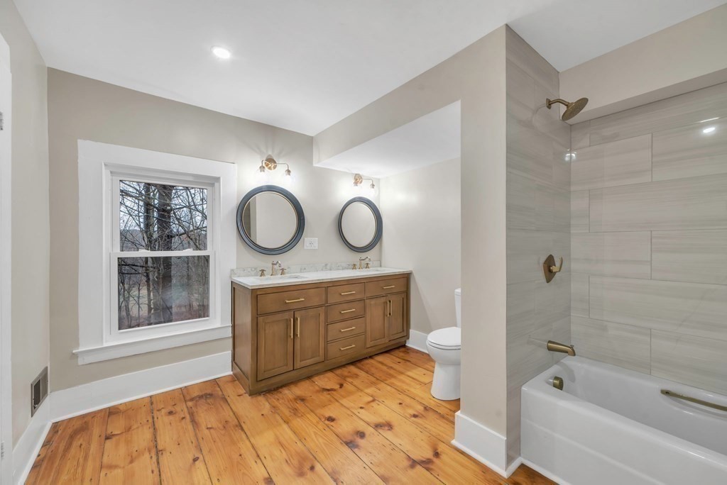 1385 Lyon Street Ludlow, MA 01056 - Photo 30 of 35 a bedroom with a bed and a window