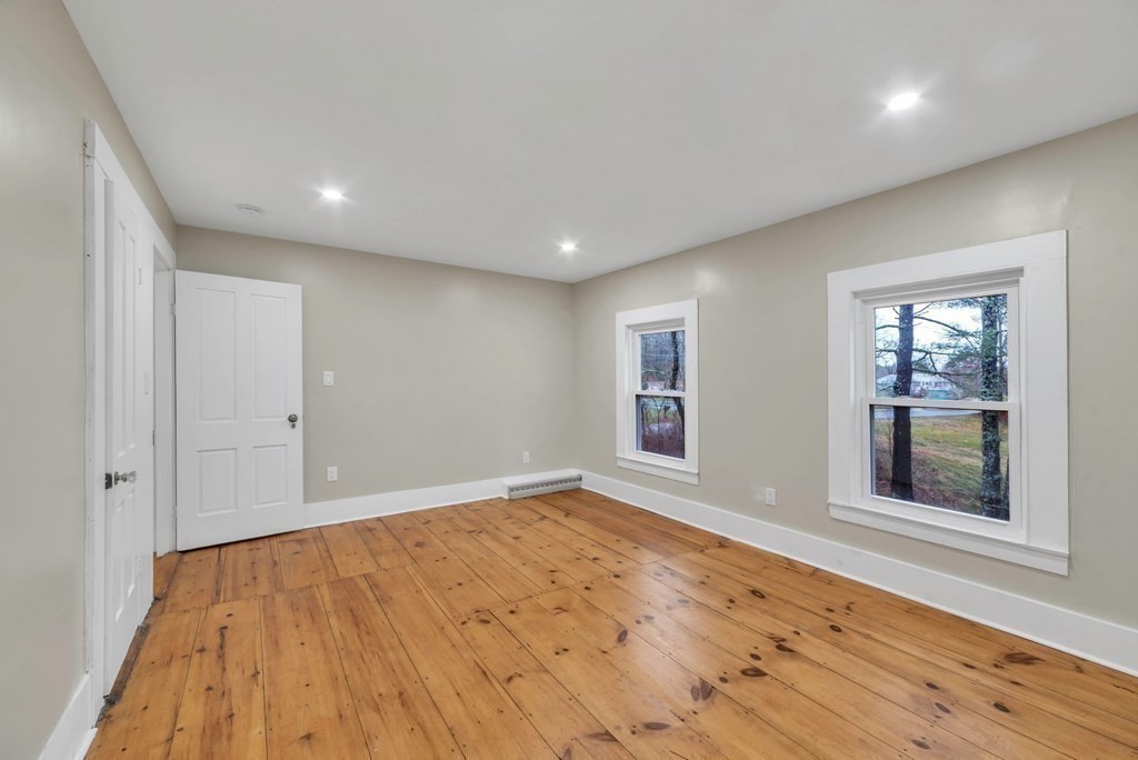 1385 Lyon Street Ludlow, MA 01056 - Photo 31 of 35 a view of empty room with wooden floor and fan