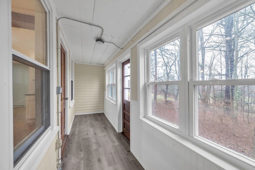 1385 Lyon Street Ludlow, MA 01056 - Photo 34 of 35 a view of hallway with windows and chandelier