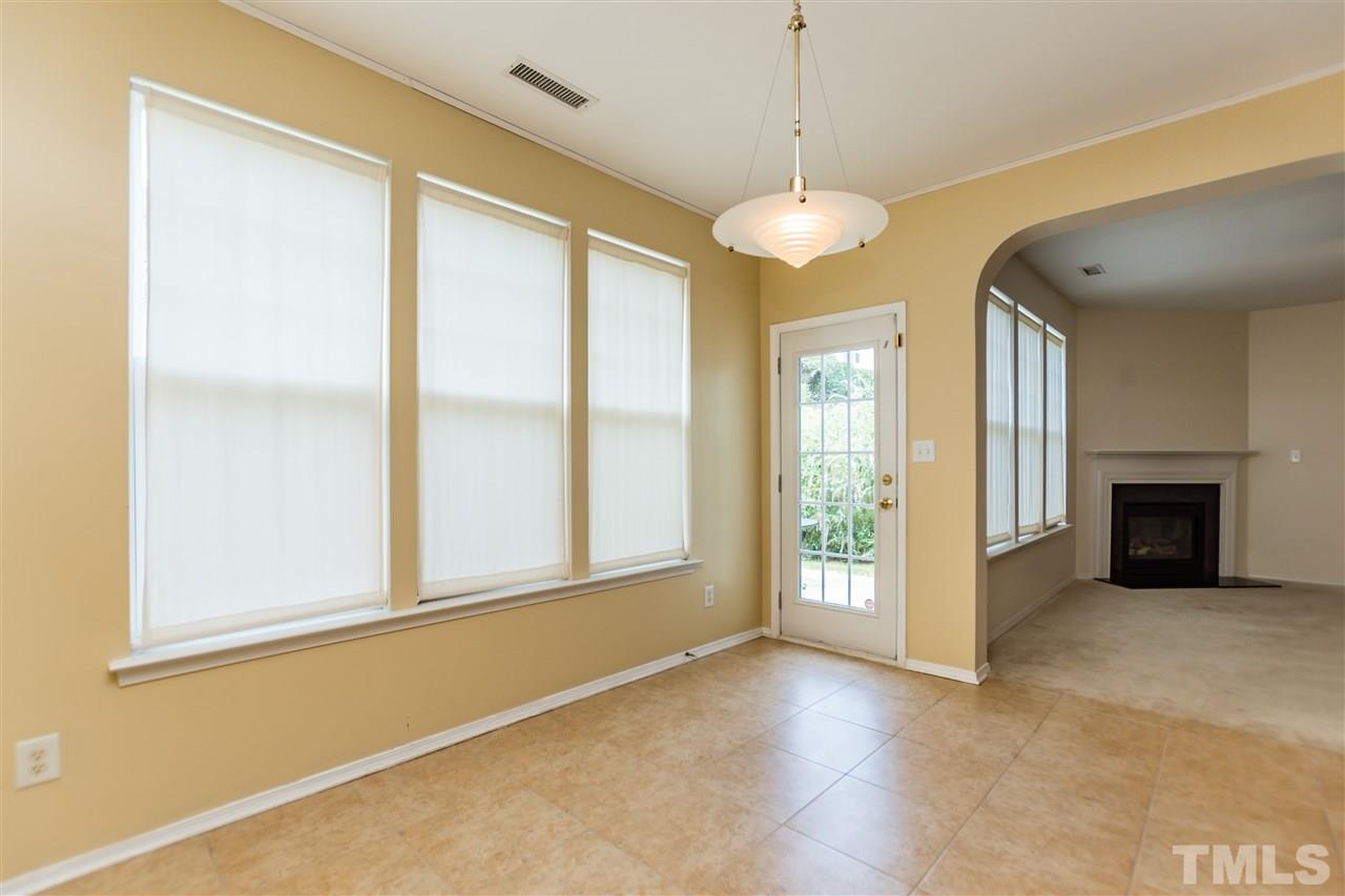 8313 Rubblestone Path Raleigh, NC 27613 - Photo 11 of 25 a view of an empty room with a window