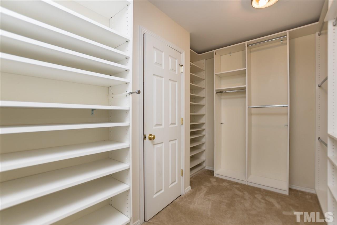 8313 Rubblestone Path Raleigh, NC 27613 - Photo 18 of 25 a view of walk in closet with empty racks