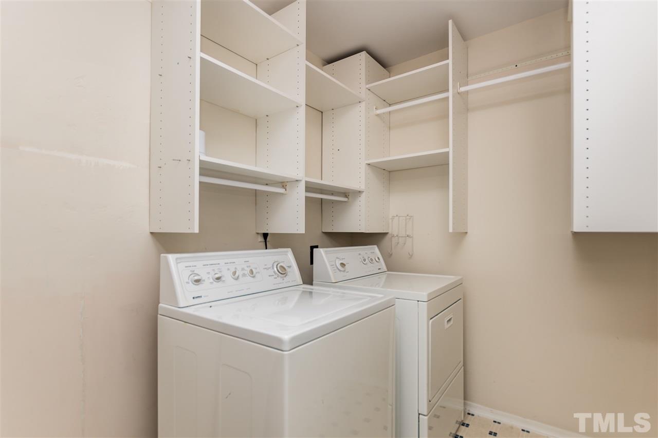 8313 Rubblestone Path Raleigh, NC 27613 - Photo 22 of 25 a utility room with dryer and washer