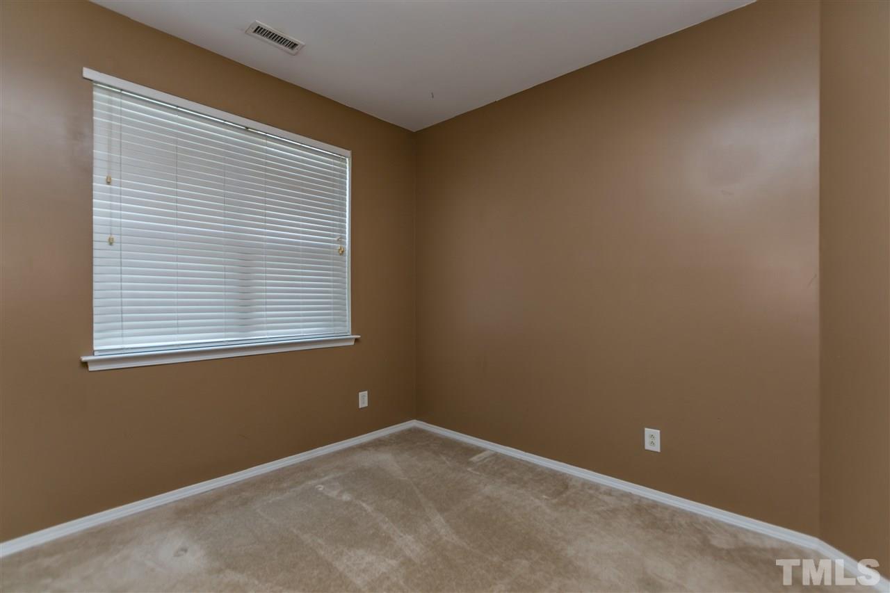 8313 Rubblestone Path Raleigh, NC 27613 - Photo 4 of 25 a view of an empty room with a window