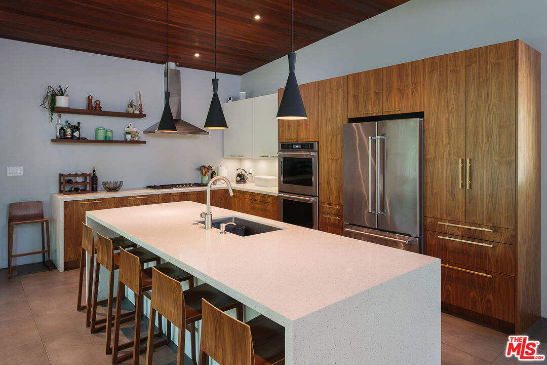1540 Lancashire Place Pasadena, CA 91103 - Photo 11 of 31 a kitchen with stainless steel appliances a sink and refrigerator
