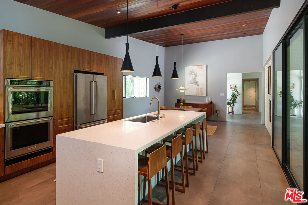 1540 Lancashire Place Pasadena, CA 91103 - Photo 12 of 31 a large kitchen with a table and chairs