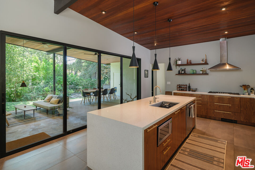 1540 Lancashire Place Pasadena, CA 91103 - Photo 13 of 31 a kitchen with stainless steel appliances granite countertop a sink and a stove