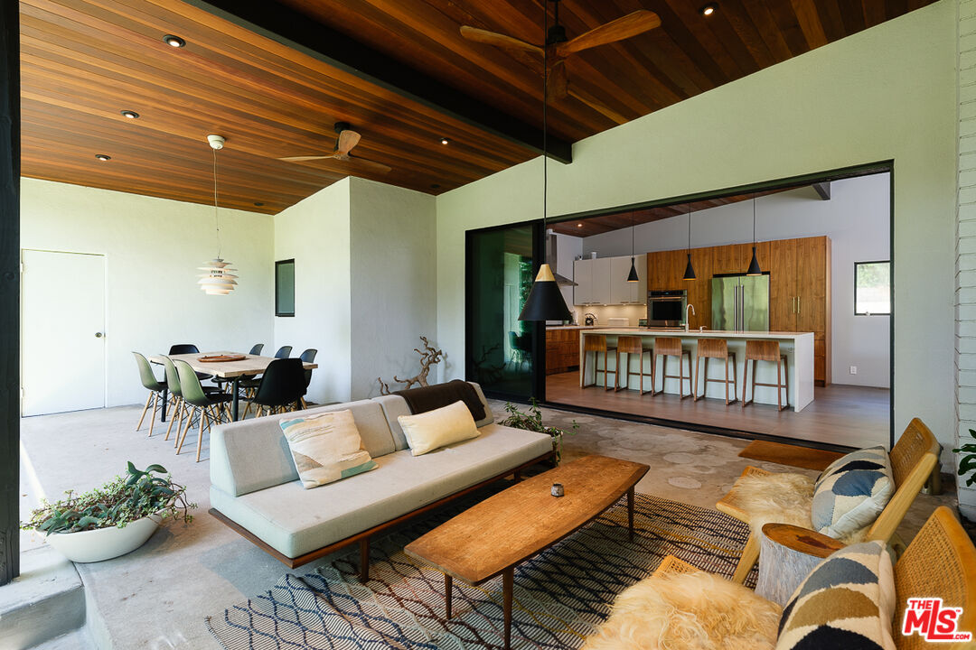 1540 Lancashire Place Pasadena, CA 91103 - Photo 18 of 31 a living room with furniture a rug and a potted plant