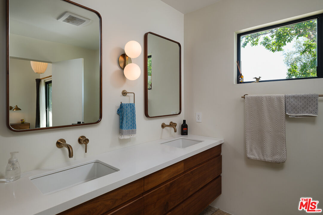 1540 Lancashire Place Pasadena, CA 91103 - Photo 20 of 31 a bathroom with a double vanity sink mirror and double
