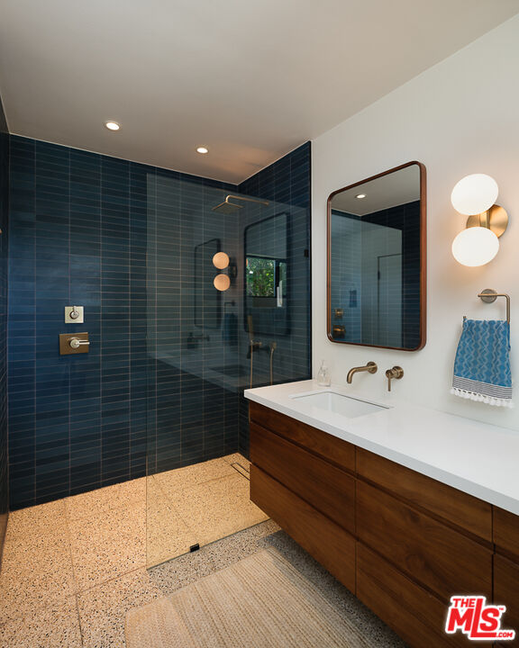 1540 Lancashire Place Pasadena, CA 91103 - Photo 21 of 31 a bathroom with a sink a toilet and mirror