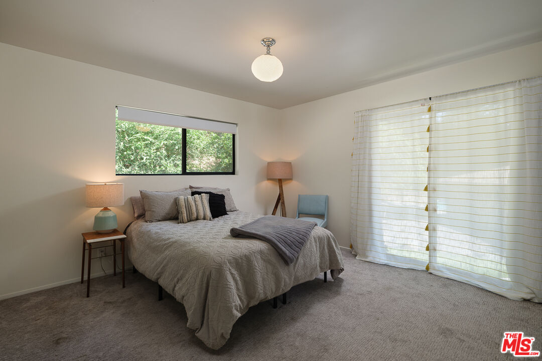 1540 Lancashire Place Pasadena, CA 91103 - Photo 22 of 31 a bedroom with a bed and a window