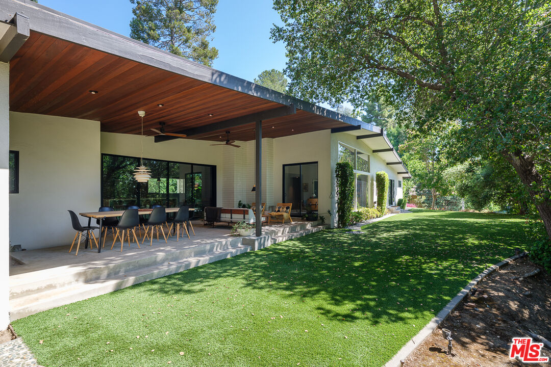 1540 Lancashire Place Pasadena, CA 91103 - Photo 26 of 31 a view of patio with table and chairs under an umbrella