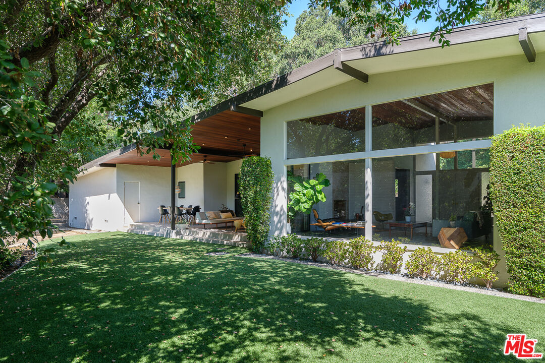 1540 Lancashire Place Pasadena, CA 91103 - Photo 27 of 31 a front view of a house with a yard and porch