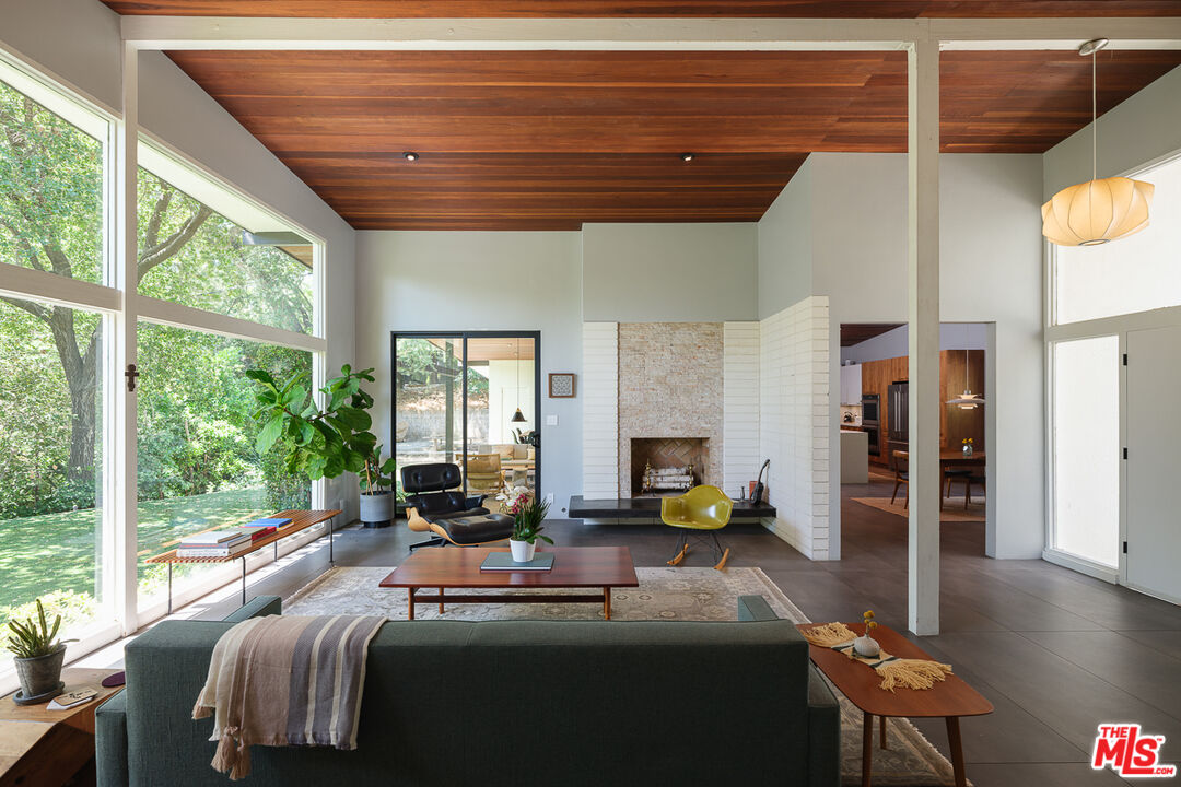 1540 Lancashire Place Pasadena, CA 91103 - Photo 3 of 31 a living room with furniture and a floor to ceiling window