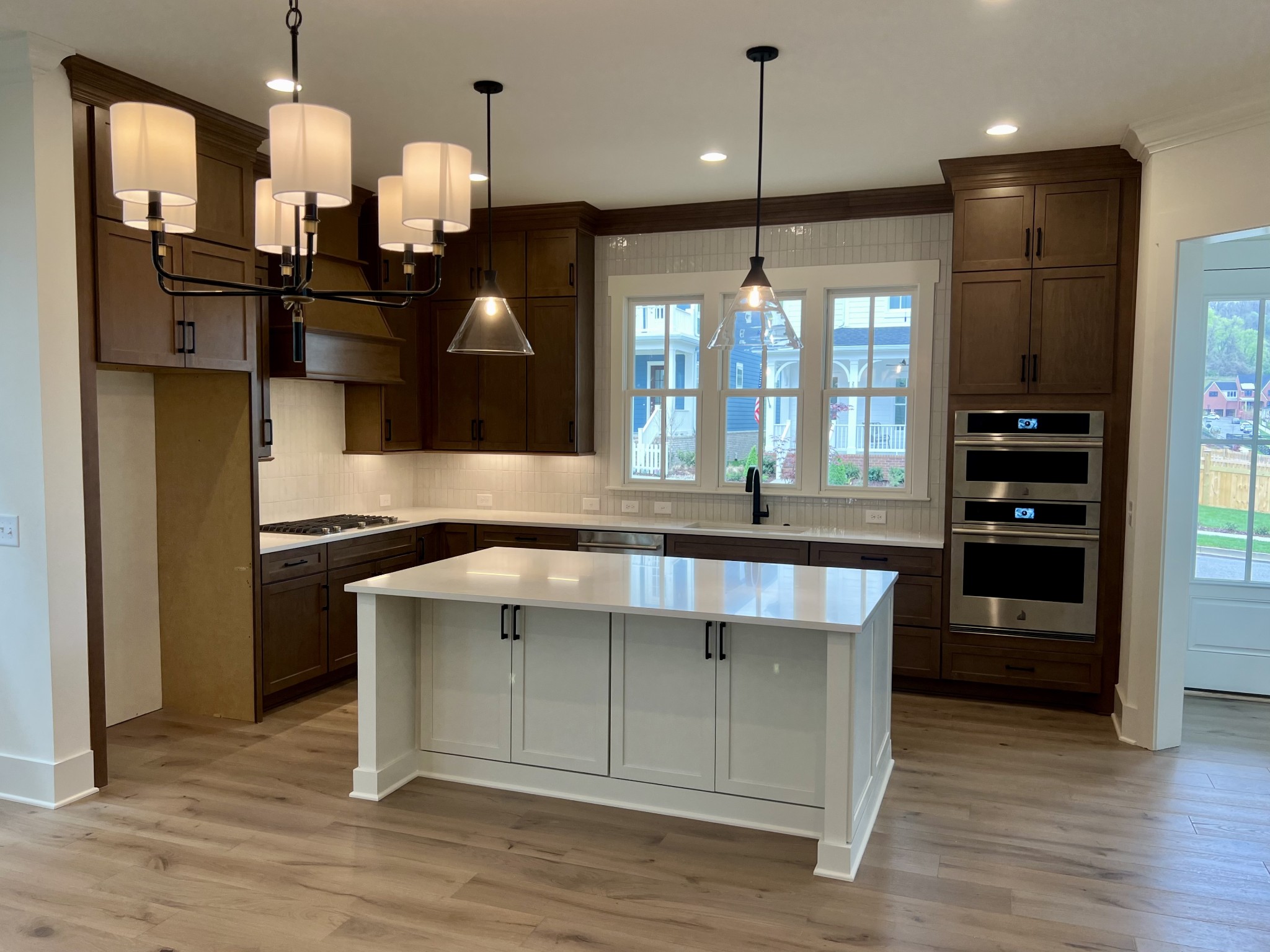 2007 Nathaniel Road Franklin, TN 37064 - Photo 4 of 12 a kitchen with a stove a refrigerator and a wooden floor