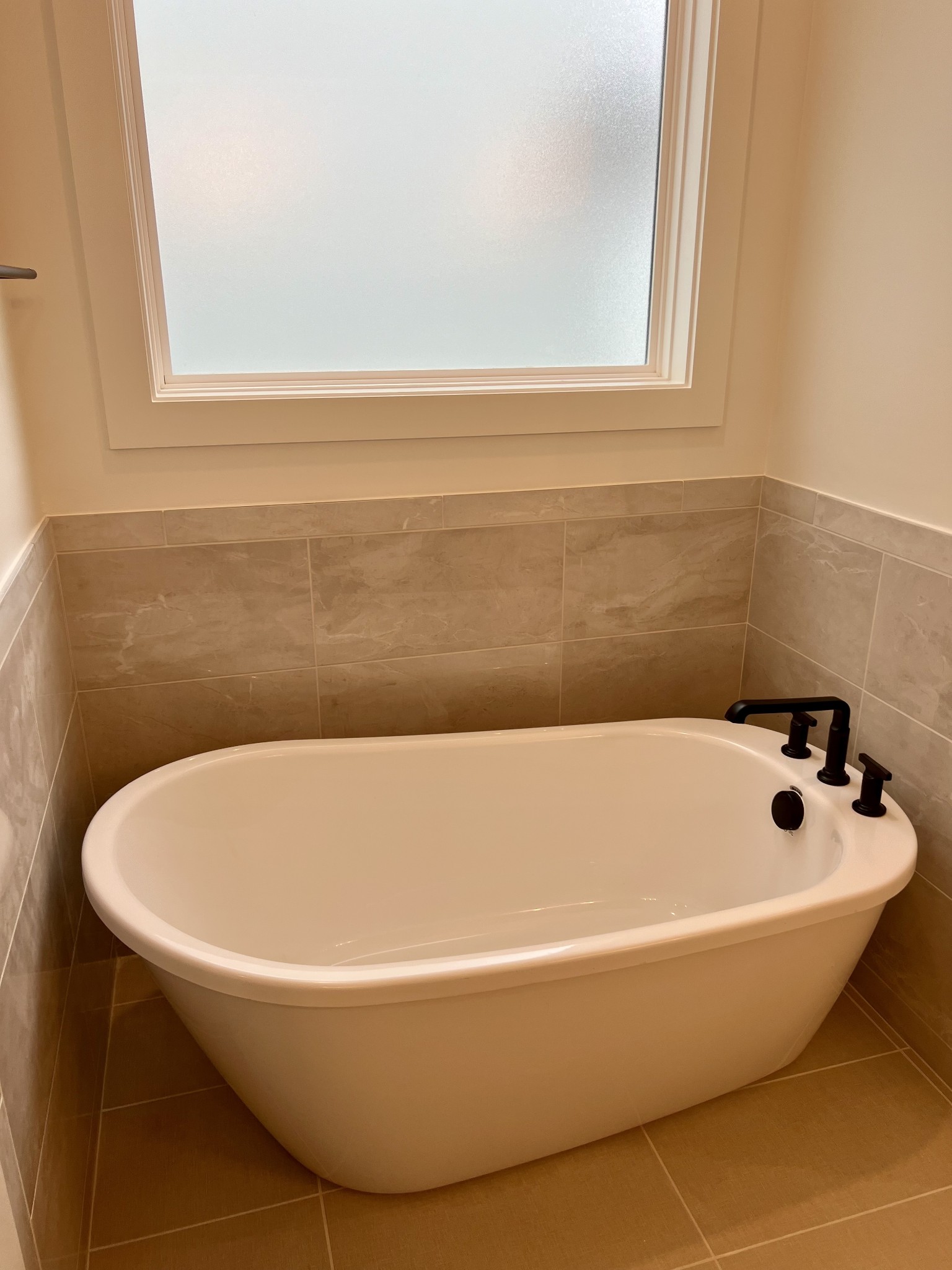 2007 Nathaniel Road Franklin, TN 37064 - Photo 8 of 12 a white bath tub sitting in a bathroom